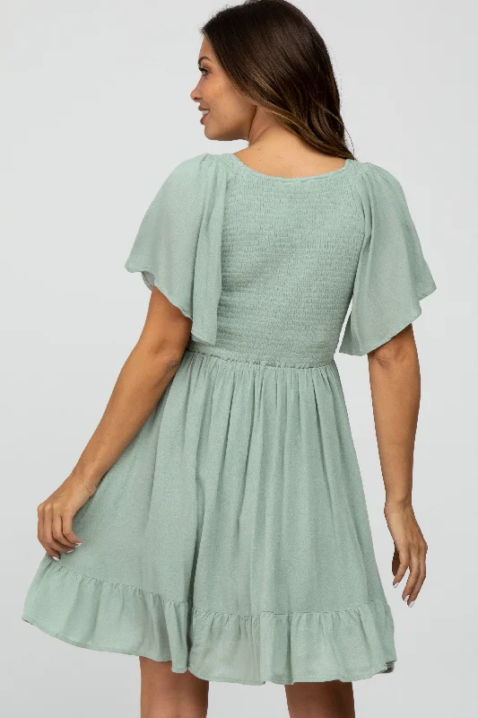 mint-green-smocked-front-ruffle-hem-maternity-dress